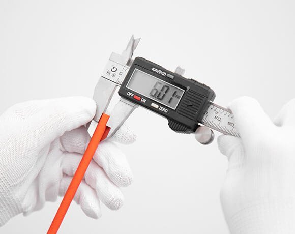 Digital caliper checking a paper straw dimension